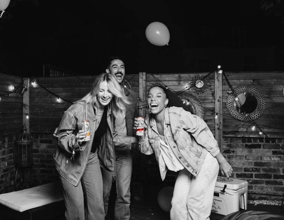 3 laughing with can facing BW  I2A7450