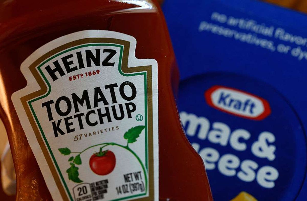 A bottle of Heinz tomato ketchup is displayed next to a box of Kraft Mac & Cheese