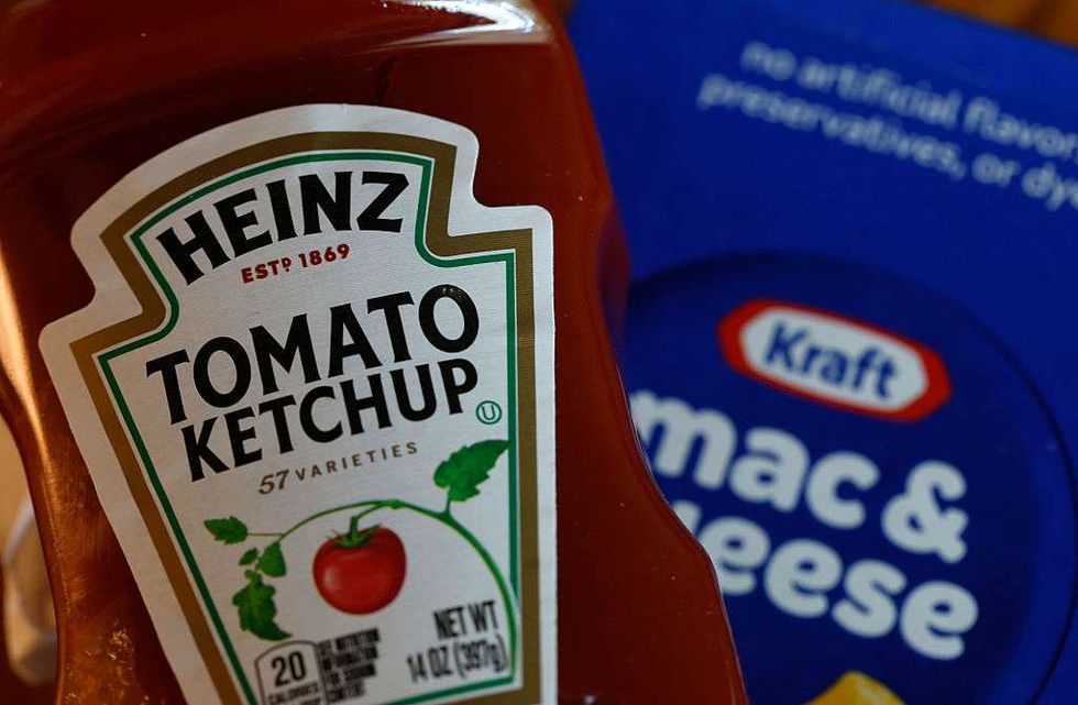 A bottle of Heinz tomato ketchup is displayed next to a box of Kraft Mac & Cheese
