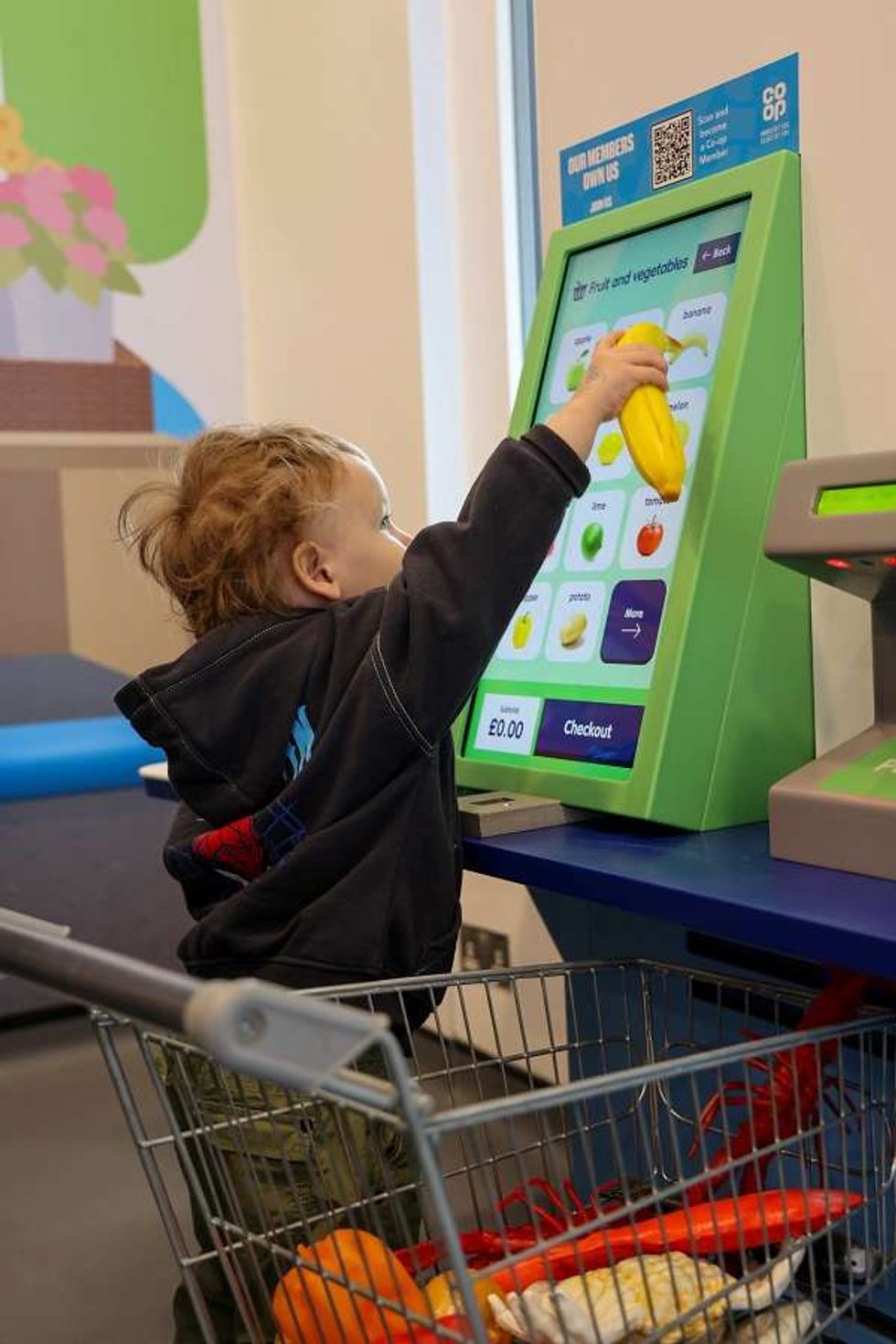 A child at the Co\u2011op Play Shop