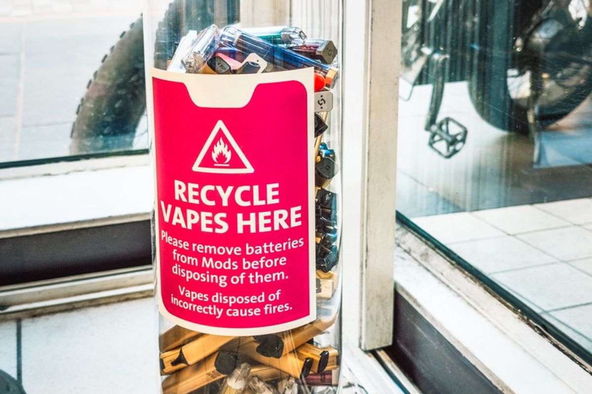 A high street collection bin of single-use vapes for recycling and safety.