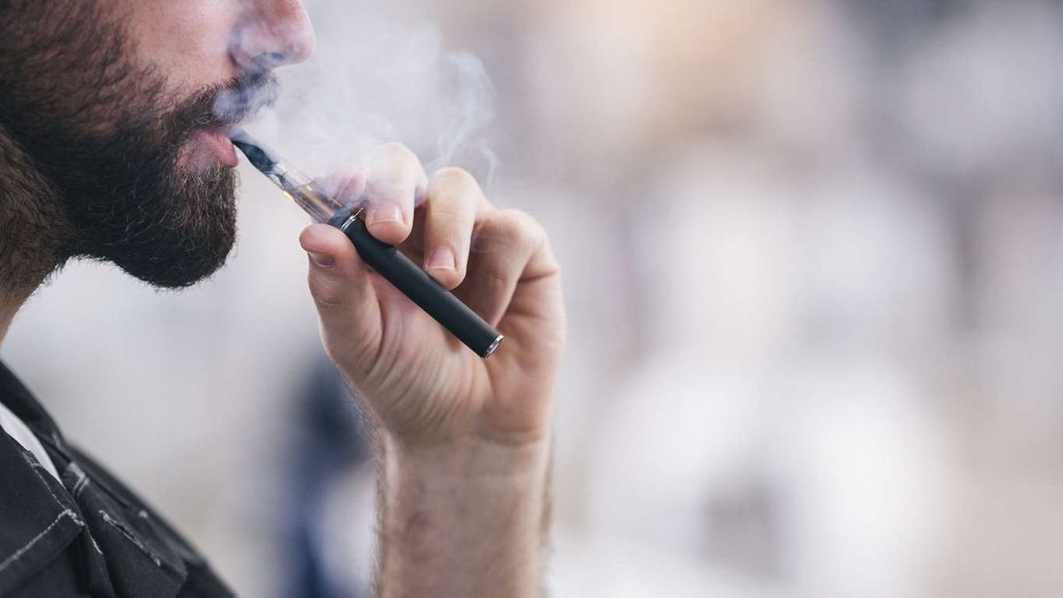 a man vaping e-cigarette 