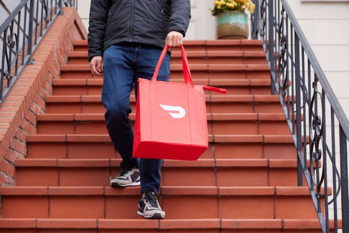 a person making a delivery with DoorDash