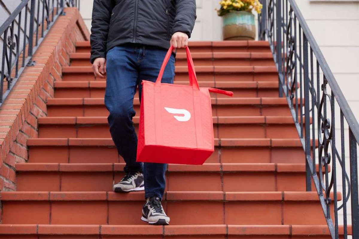 a person making a delivery with DoorDash