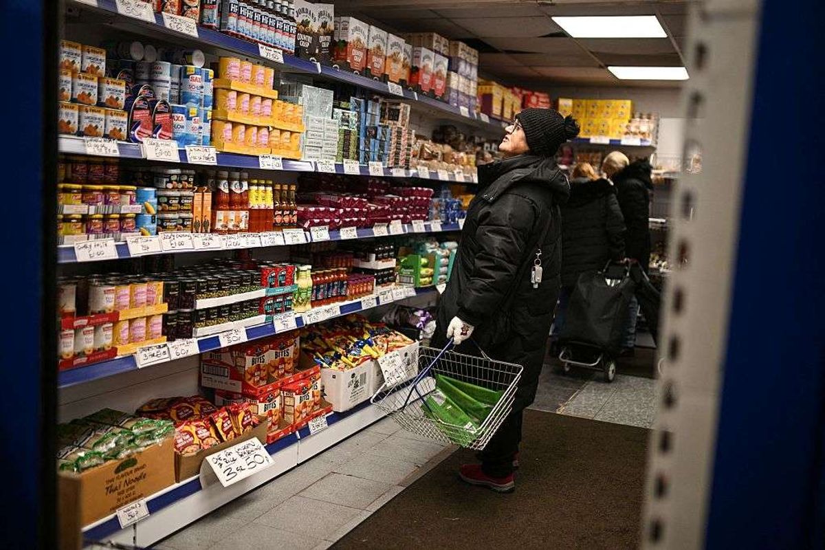 A shopper looks at items in a shop