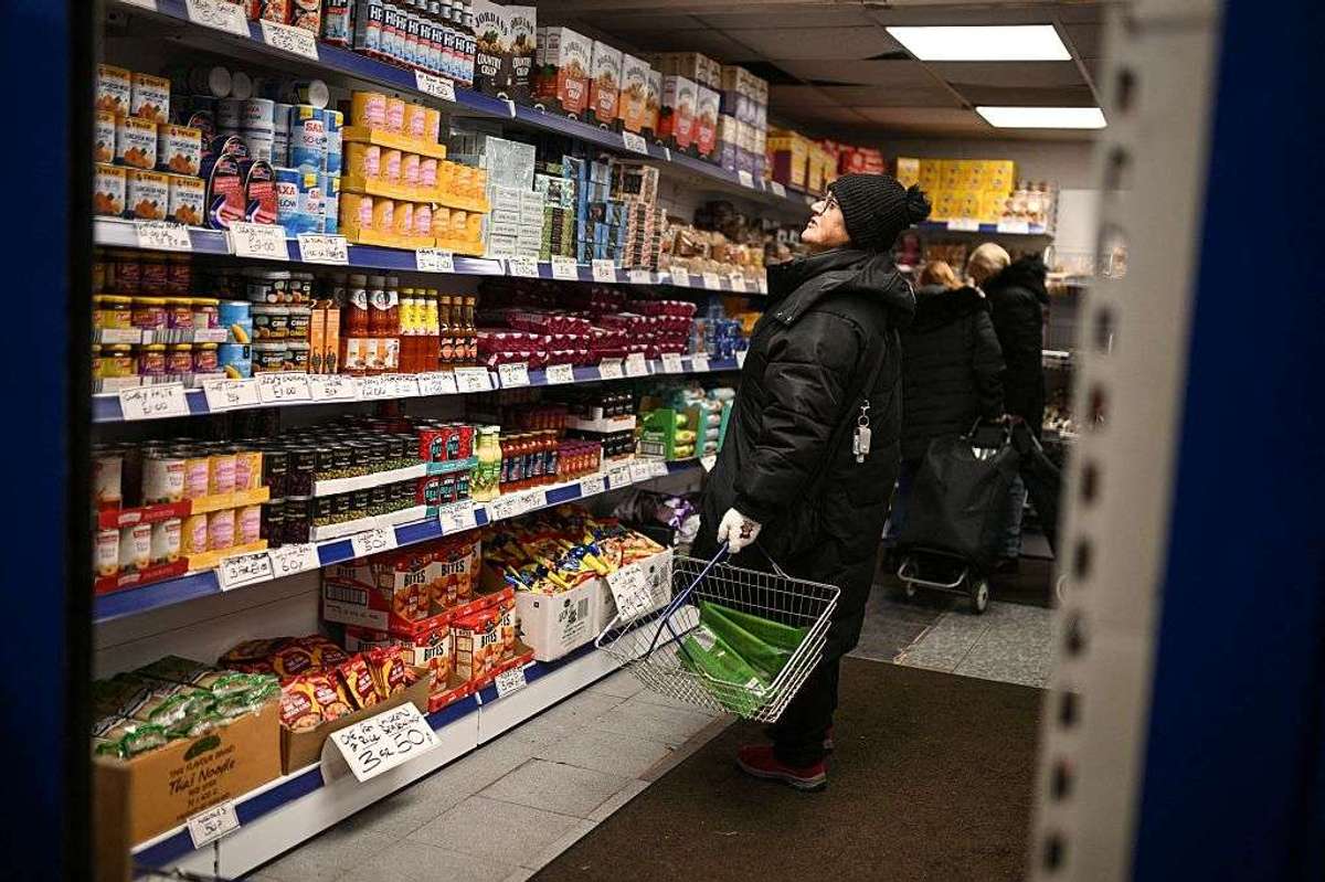 A shopper looks at items in a shop