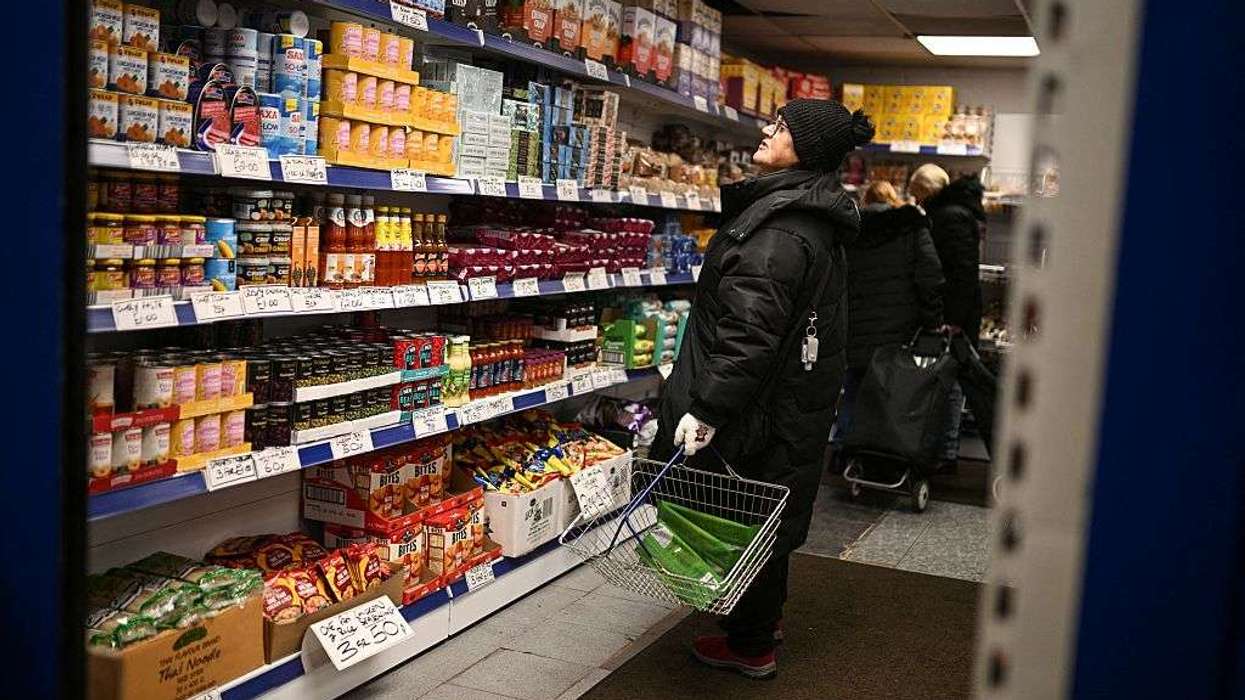 A shopper looks at items in a shop