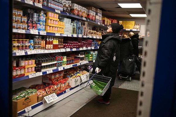 A shopper looks at items in a shop