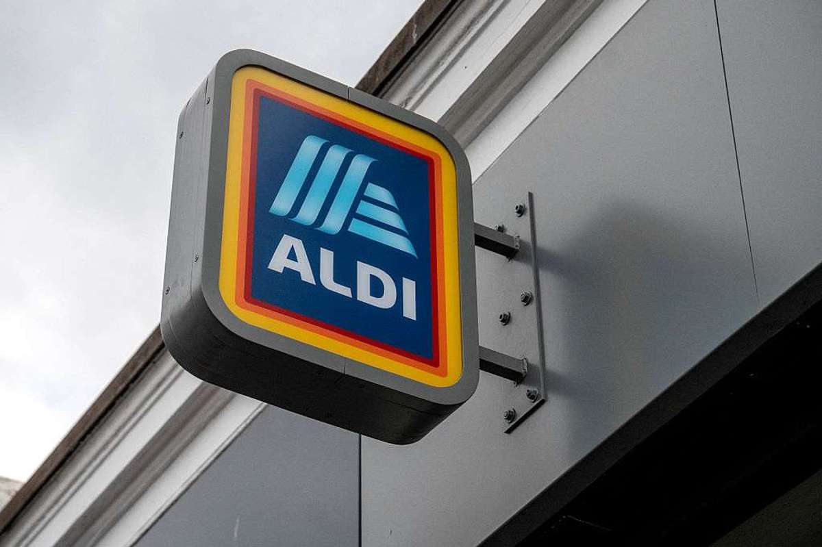 A sign hangs outside a ALDI branch in Balham