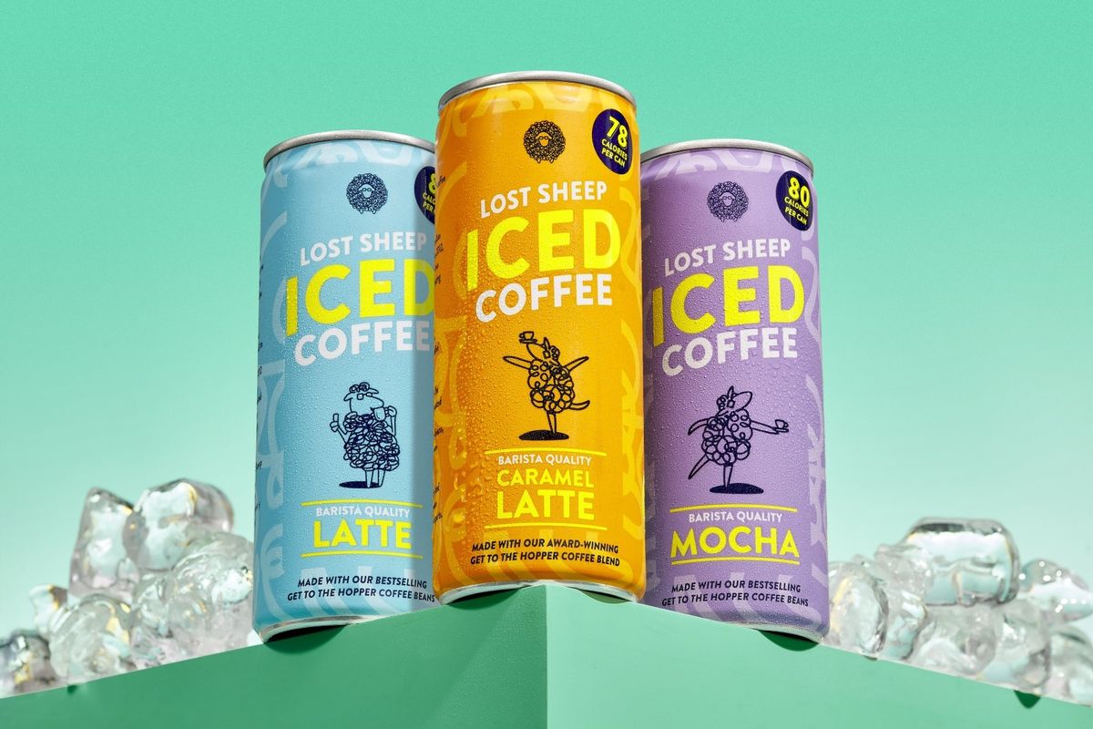 A sleek can of Lost Sheep Coffee’s Iced Caramel Latte on a café table, showcasing its 2025 specialty-grade, traceable RTD range.