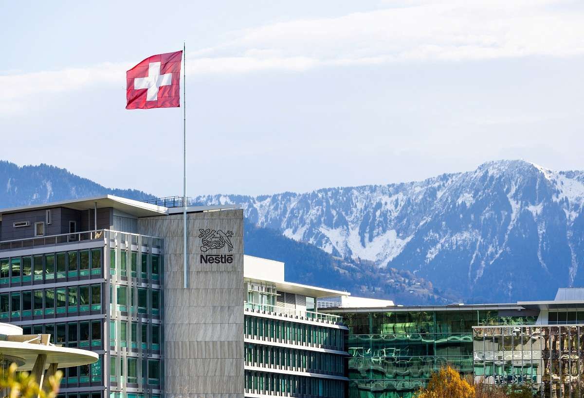 A Swiss flag flutters on the headquarters of Nestle in Vevey, Switzerland