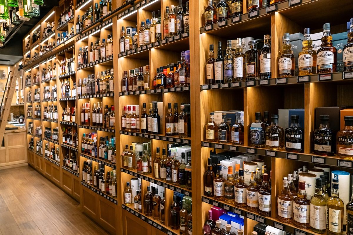 A Wall Full of Scotch Whiskey Bottles at a Liquor Store in London England