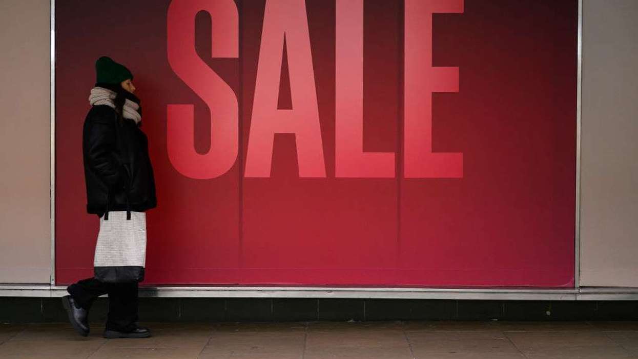 a window display advertising an ongoing sale