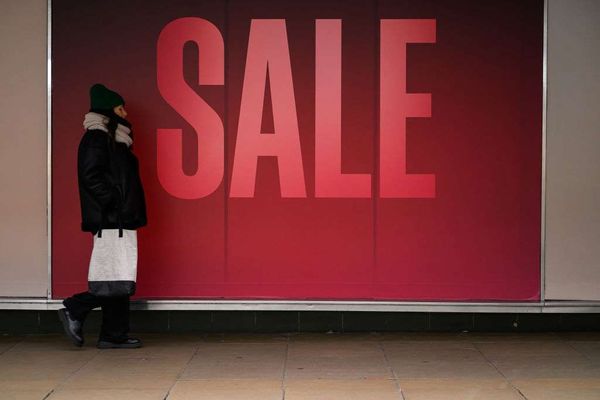 a window display advertising an ongoing sale