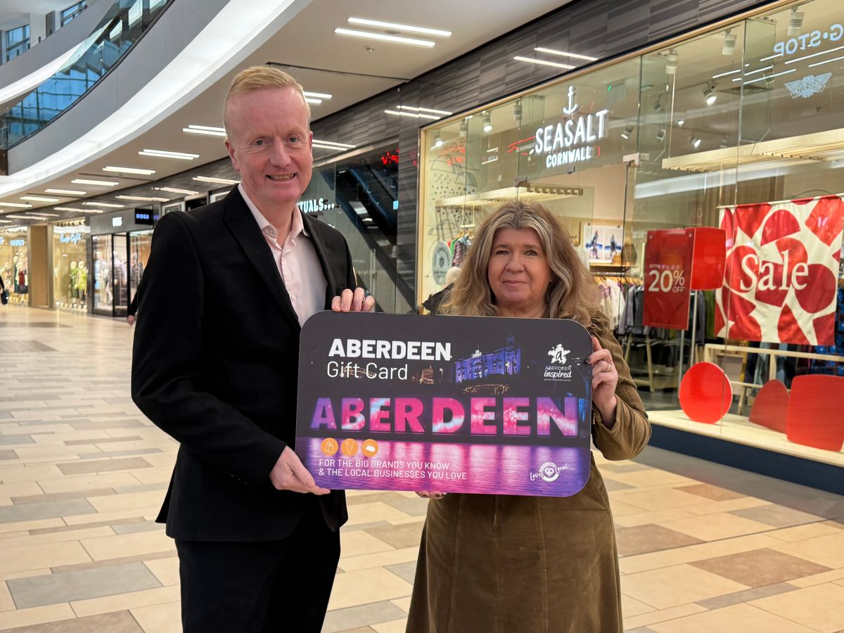 Adrian Watson and Shona Byrne, of Aberdeen Inspired, with the Aberdeen Gift Card