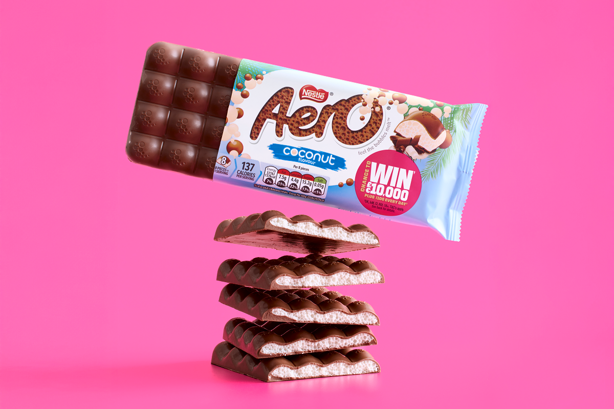 Aero Coconut chocolate bar with bubbly texture on tropical background