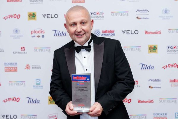 Andy Campbell with Asian Trader Awards trophy