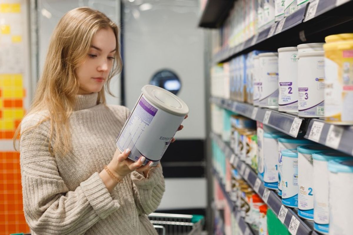 Baby formula products on UK retail shelves with price labels