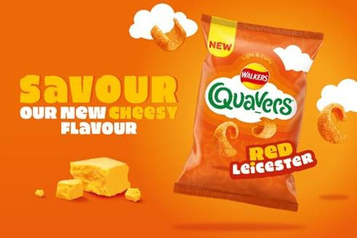 Bag of Walkers Quavers Red Leicester with cheese chunks and curls on orange background.