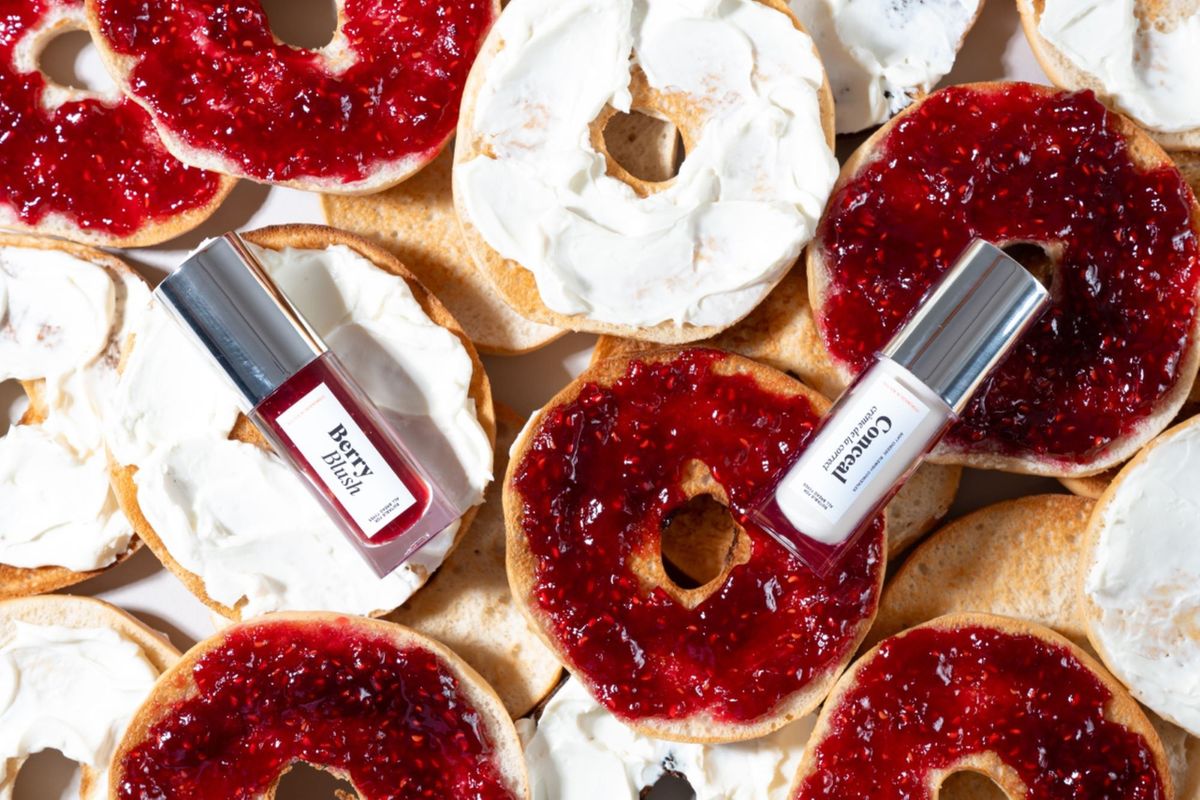 Bagels with cream cheese and jam featuring Warburtons spoof beauty range products Berry Blush and Conceal Cream.