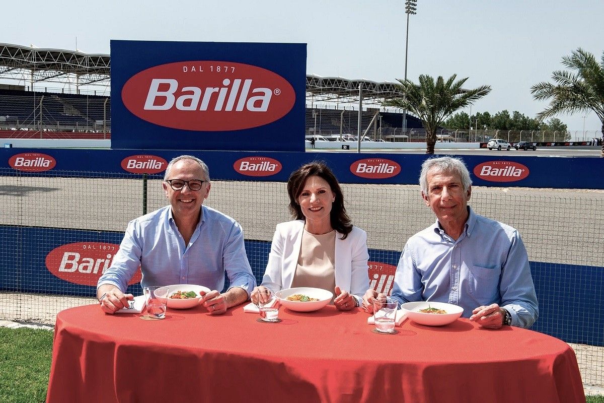 Barilla pasta served in Formula 1 Paddock Club with F1 cars in background
