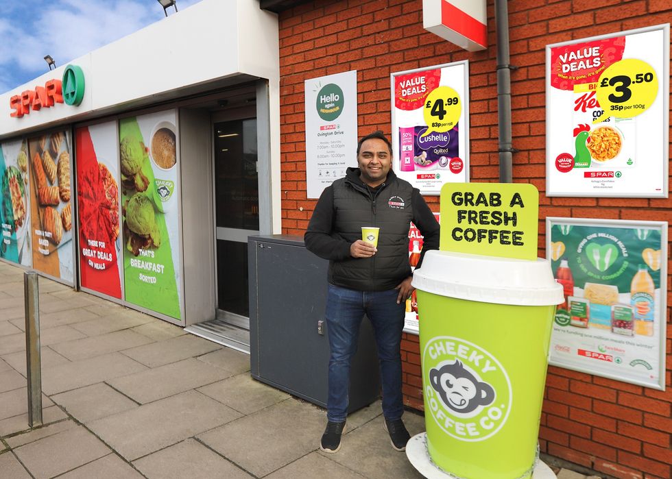 Bhavesh Parekh of SPAR Southport with Cheeky Coffee sign