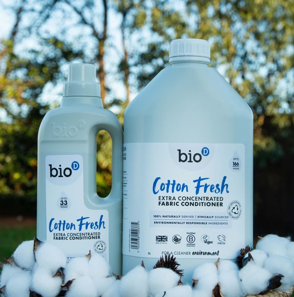 Bio-D Cotton Fresh fabric conditioner bottles with cotton, promoting eco-friendly cleaning