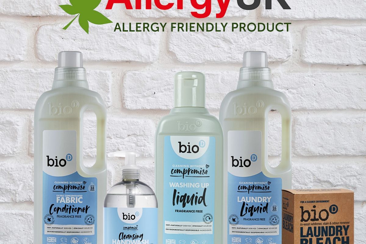 Bio-D's Allergy UK-endorsed fragrance-free cleaning products lined up on a wooden shelf in a home kitchen.