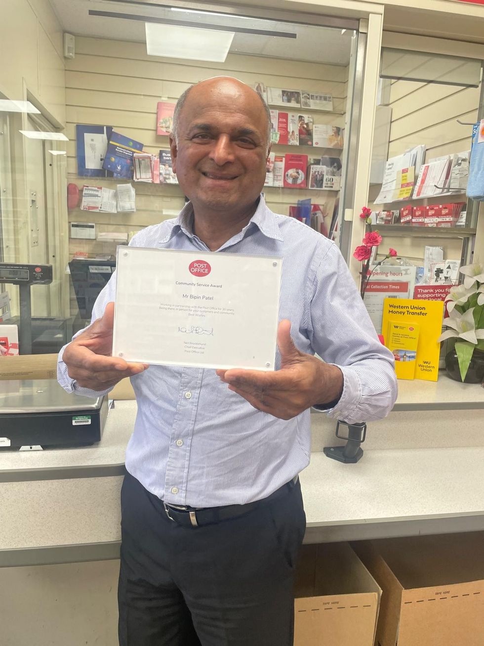 Bipin Patel with his long-service award