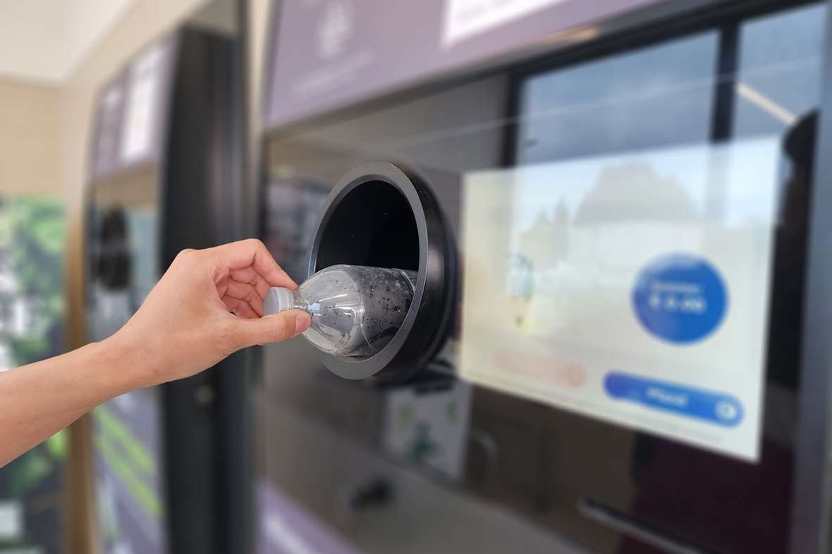 Bringing used water bottles to recycle at vending machines