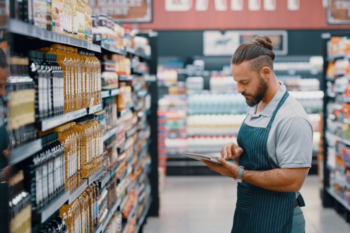 British independent shop owner using AI tools for marketing, saving time and cutting costs