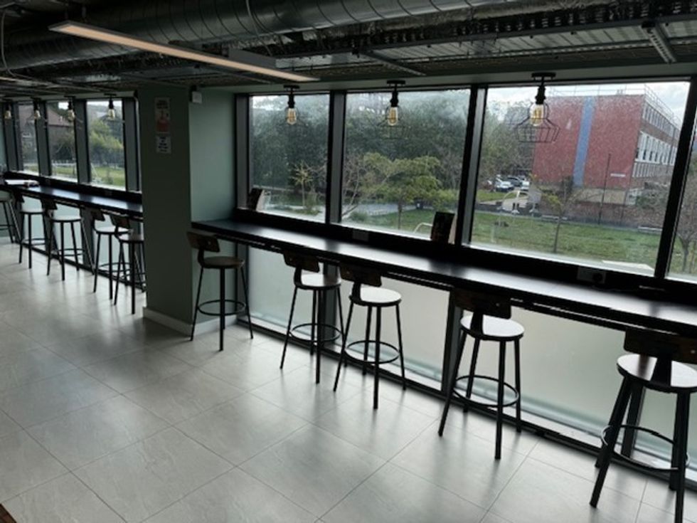 Budgens store hosting community activities like yoga and tutoring.