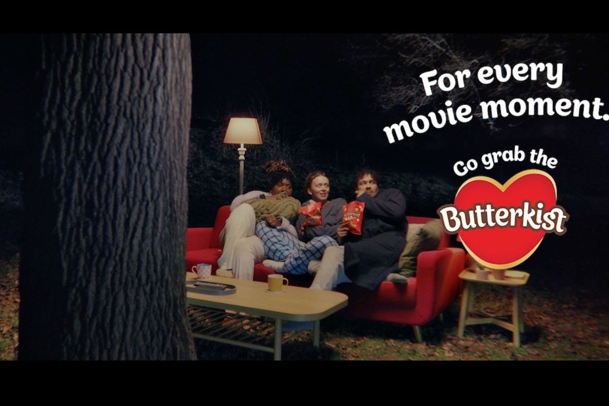 Butterkist popcorn characters watching movie from red sofa in new TV ad campaign
