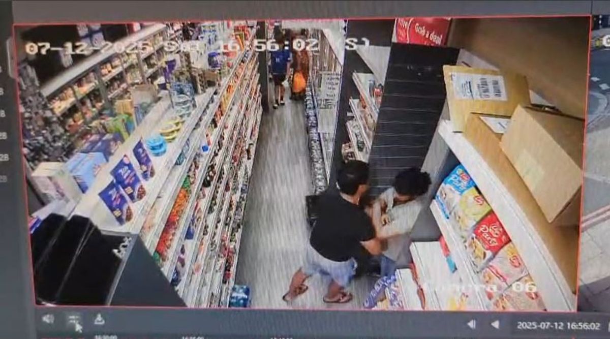 CCTV footage appearing to show Cllr Tiwari attempting to push past the employee.
