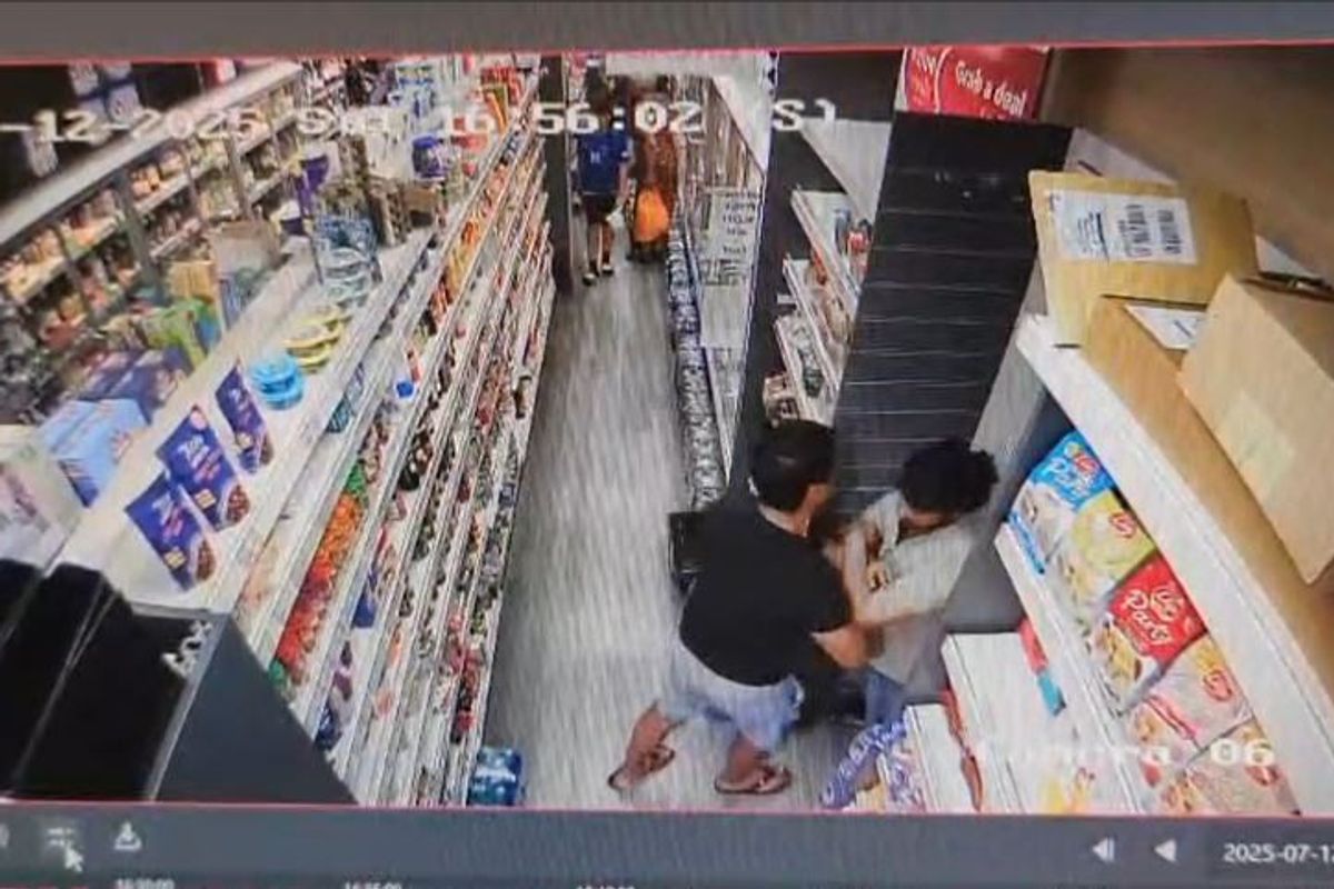 CCTV footage appearing to show Cllr Tiwari attempting to push past the employee.