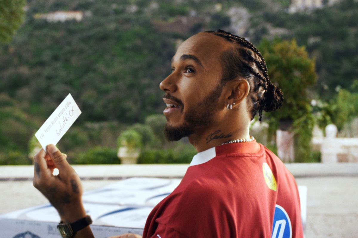 Charles Leclerc and Lewis Hamilton holding Peroni Nastro Azzurro 0.0% bottles, celebrating The Italian Way campaign.
