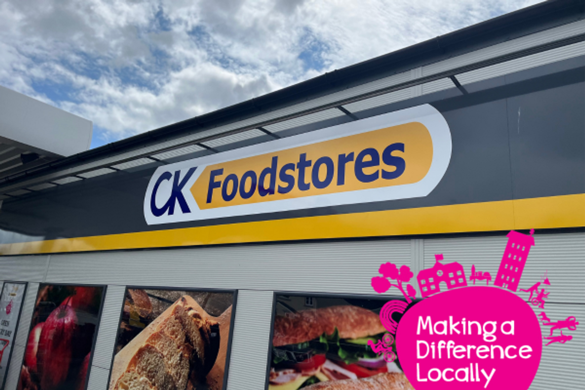CK Foodstores storefront with Making a Difference Locally logo