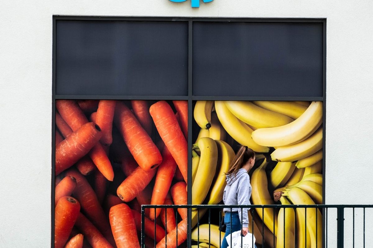 Co-op member shops for Aldi price-matched essentials like 85p milk in 2025 campaign