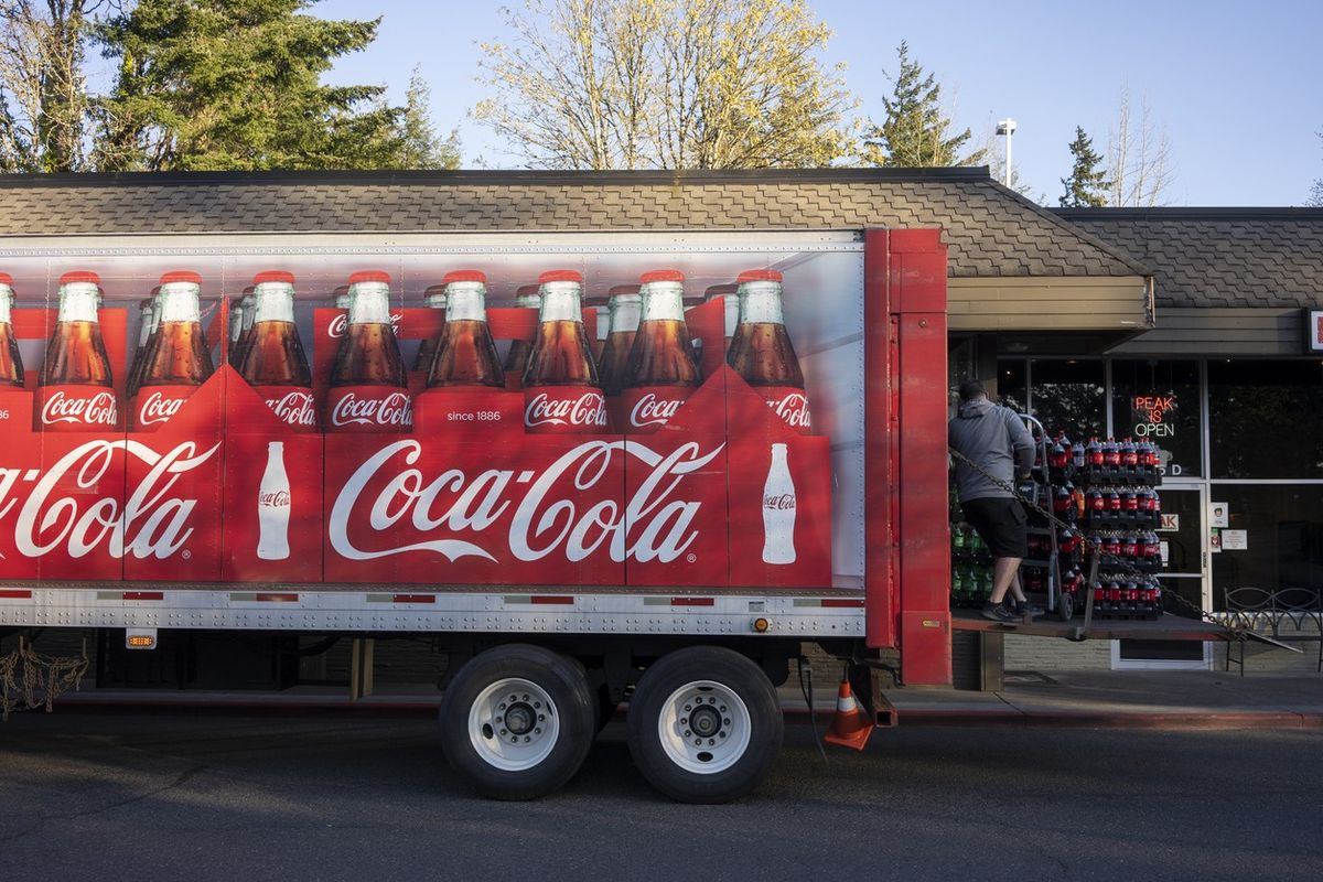 Coca-Cola delivery driver unloads his truck