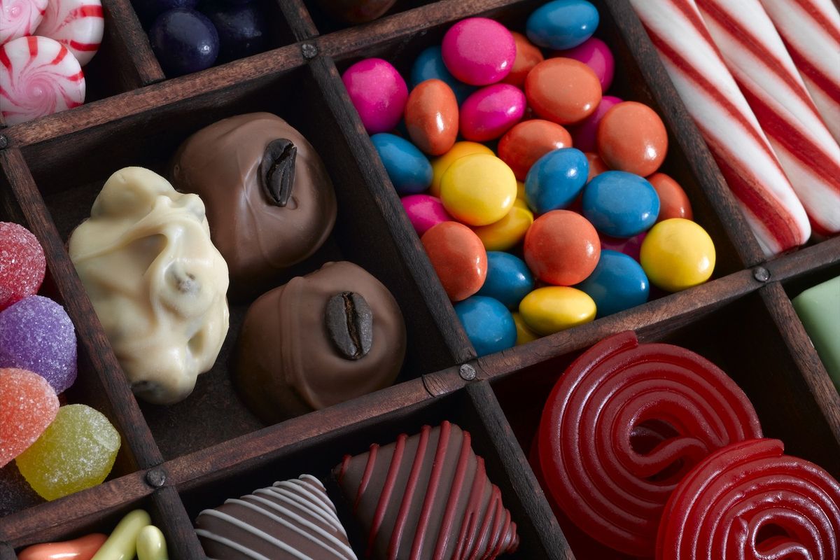 Colorful UK confectionery shelf featuring sharing bags, chocolate, and seasonal treats