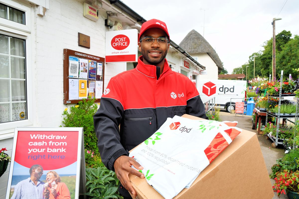 DPD driver outside a post office with parcels