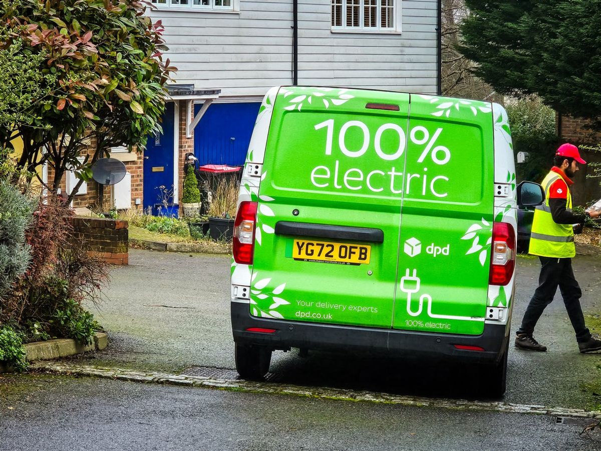 Electric DPD delivery van and driver making delivery in Crawley, UK 