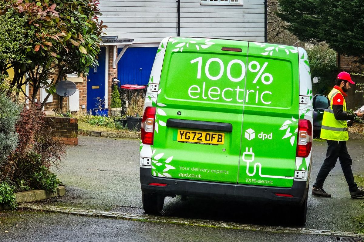 Electric DPD delivery van and driver making delivery in Crawley, UK