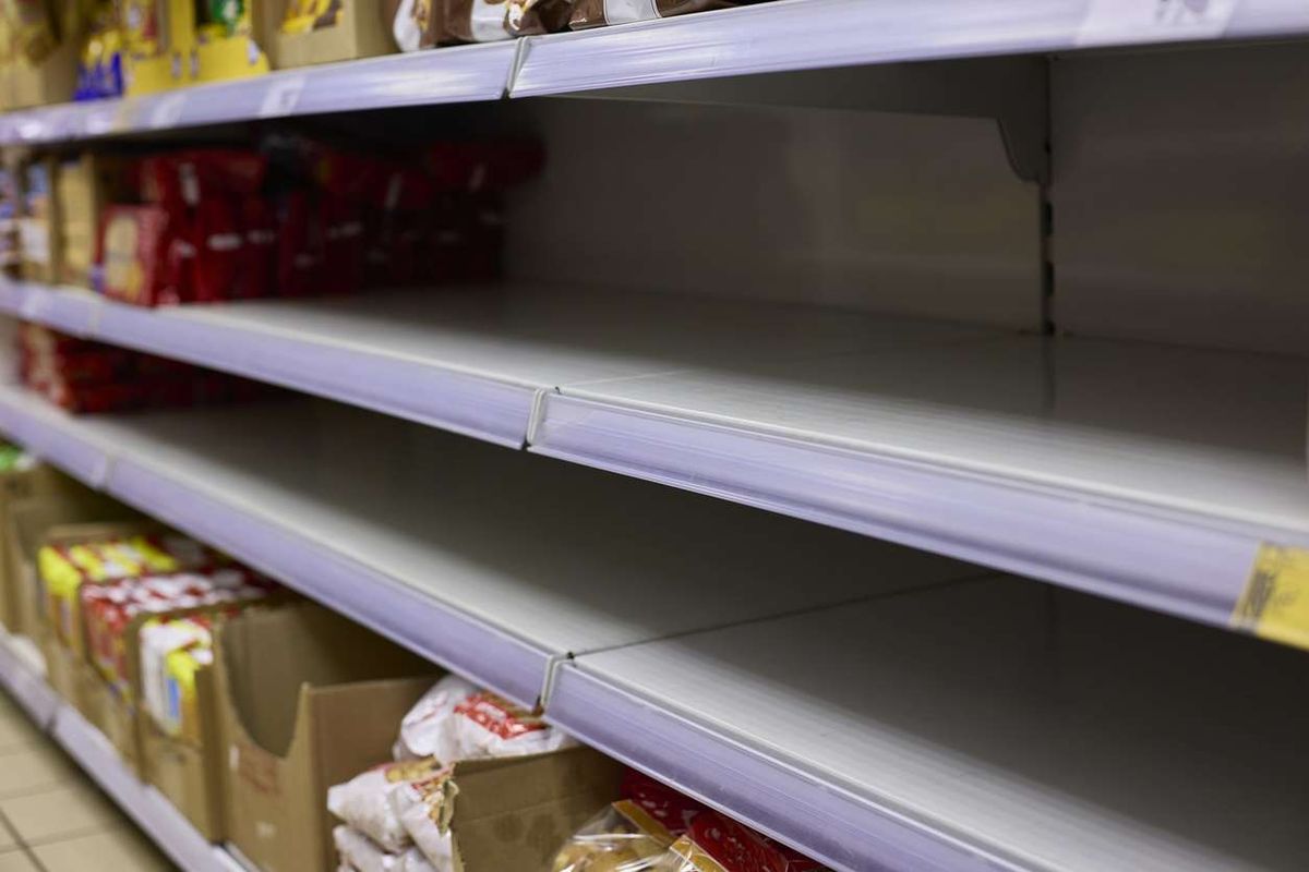 Empty Grocery Store Shelves Indicating Product Shortage