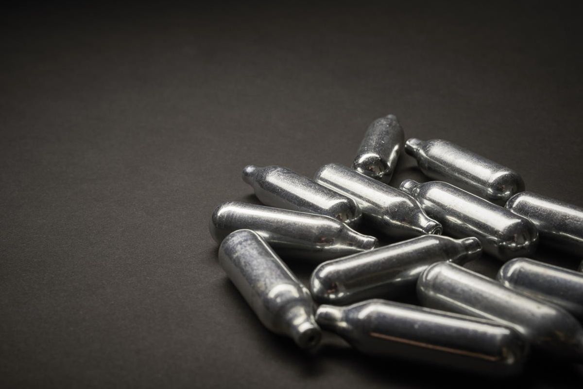 400 laughing gas canisters seized at Bolton shop