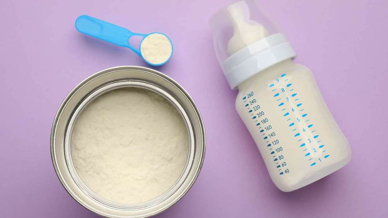 Feeding bottle with infant formula and powder
