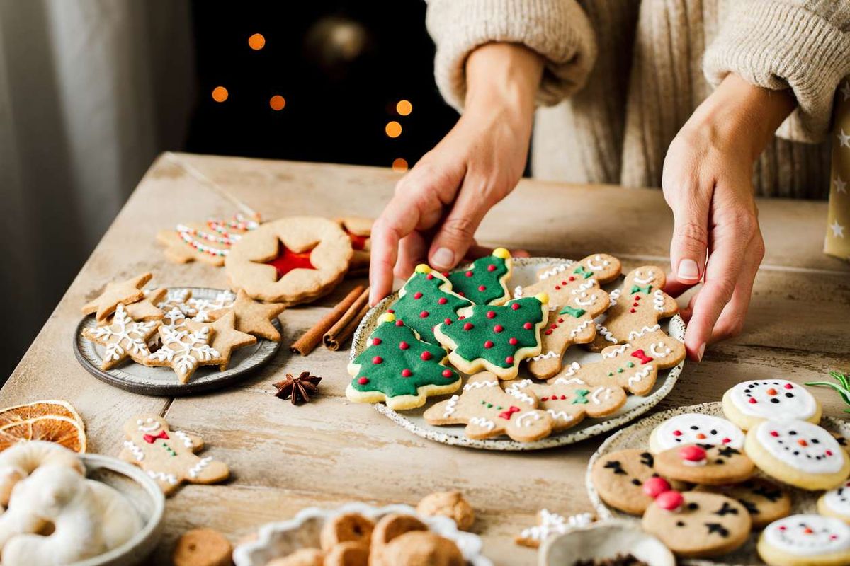 gingerbread cookies and sweets on wooden table for Christmas celebration