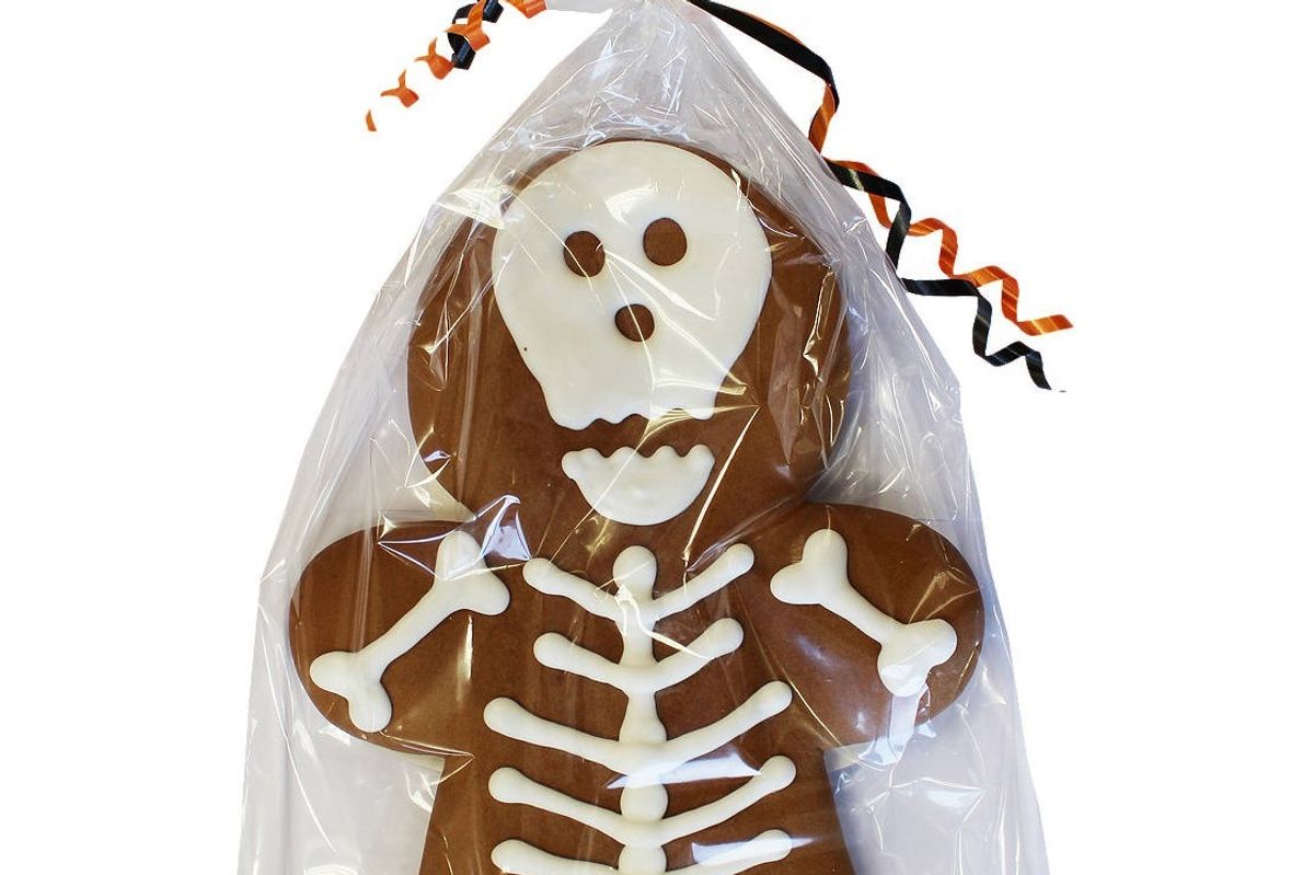 Handcrafted Halloween gingerbread figures with spooky designs, iced by Empire Bespoke Foods.