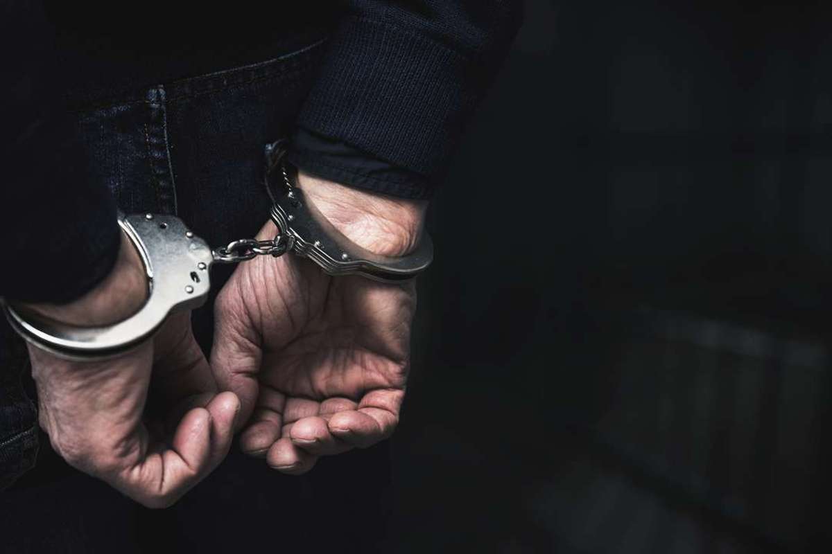 Handcuffed arrested man