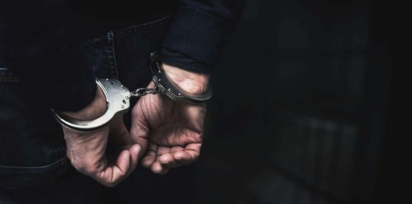 Handcuffed arrested man